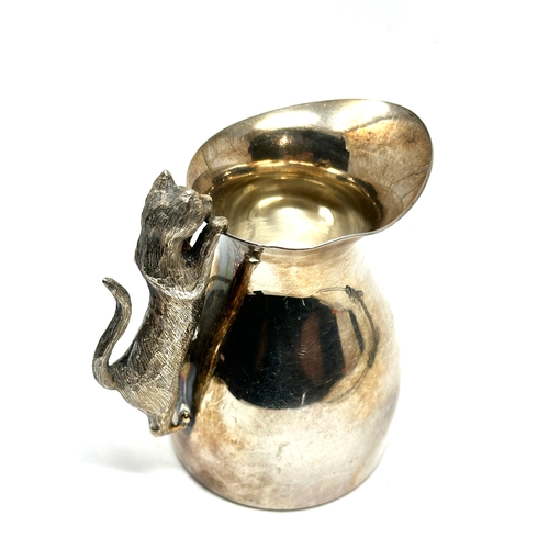 9 - Silver novelty “Cat Cream Jug” The Cat as the Handle. Made in London Date:1994 Maker: Peter Nicholas... 