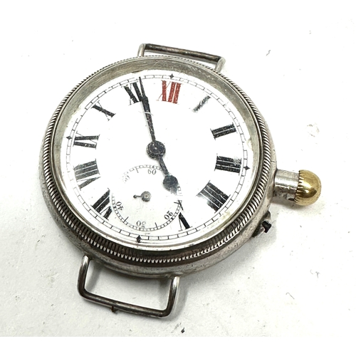 431 - ww1 silver cased trench watch the balance spins but not ticking case measures approx 33mm