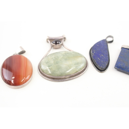 430 - Five silver stone set pendants including lapis (101g)