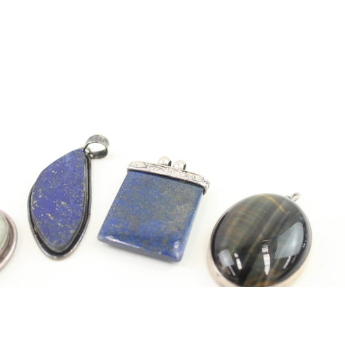 430 - Five silver stone set pendants including lapis (101g)