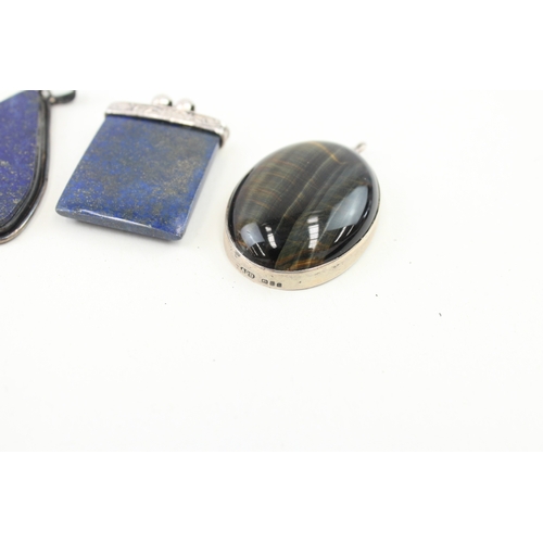 430 - Five silver stone set pendants including lapis (101g)