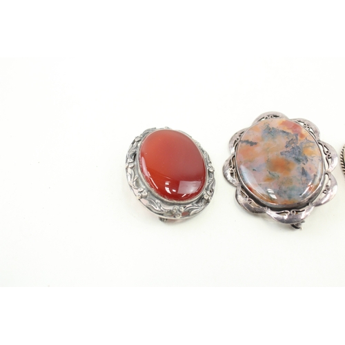 438 - Four silver stone set brooches (50g)