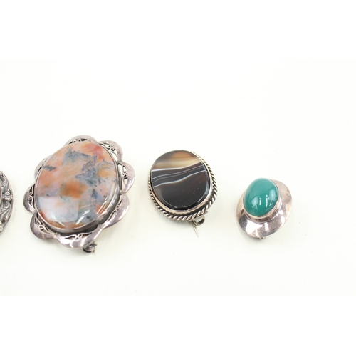 438 - Four silver stone set brooches (50g)