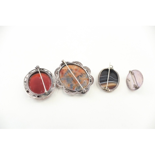 438 - Four silver stone set brooches (50g)