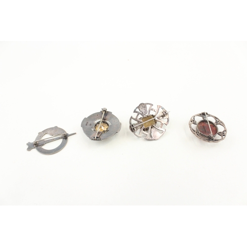 439 - Four silver Scottish brooches including a pennanular (43g)