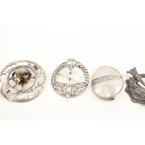 440 - A collection of Scottish silver brooches including a pennanular (37g)