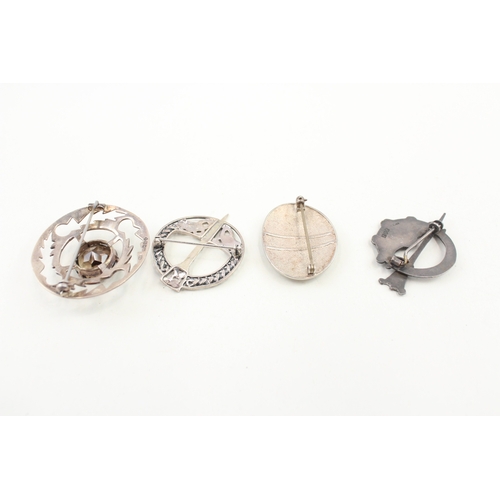 440 - A collection of Scottish silver brooches including a pennanular (37g)