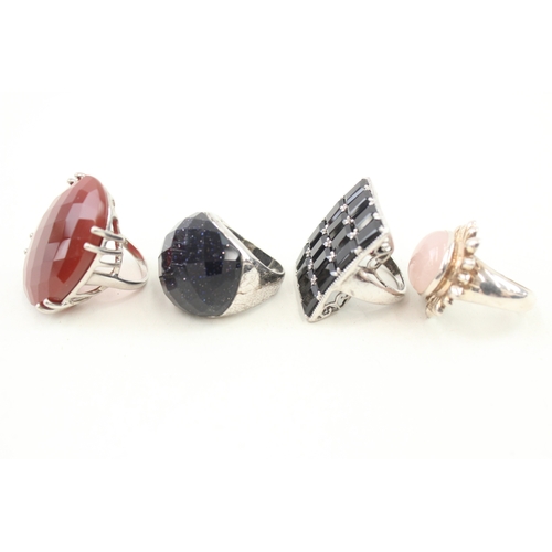 443 - Four statement silver stone set rings (61g)