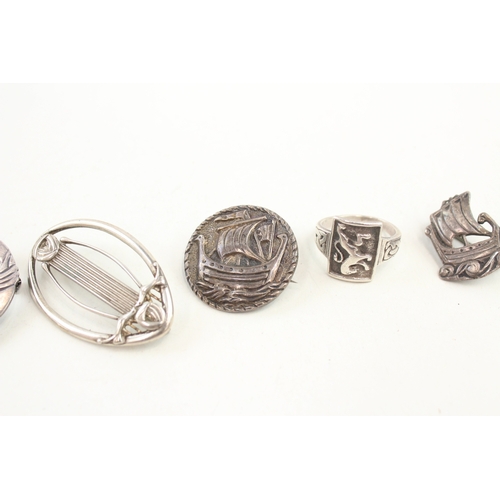 445 - Five Scottish silver brooches including an example by Ola Gorie (36g)