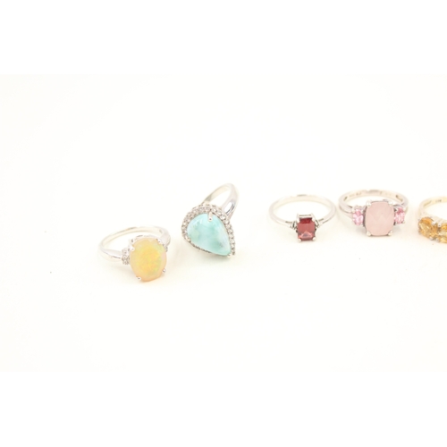 449 - A collection of silver stone set rings including larrimar and opal (29g)