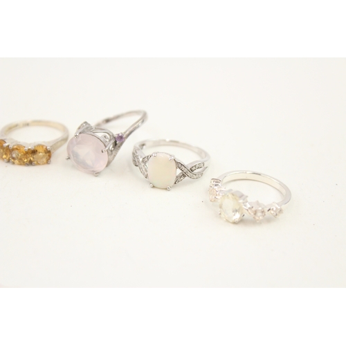 449 - A collection of silver stone set rings including larrimar and opal (29g)