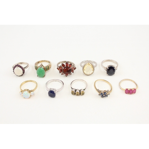 450 - Ten silver stone set rings includinh opal and ruby (41g)