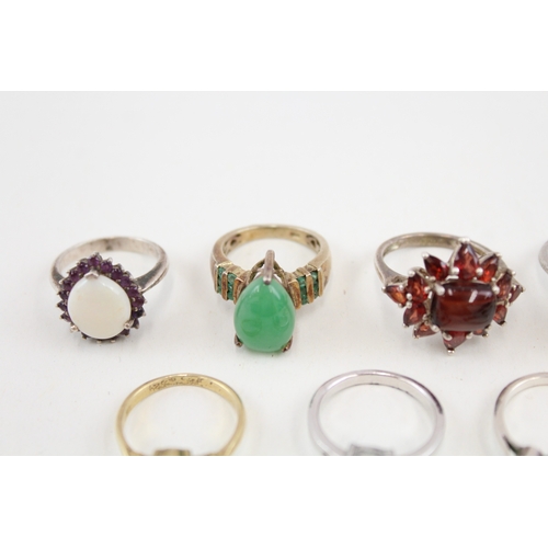 450 - Ten silver stone set rings includinh opal and ruby (41g)