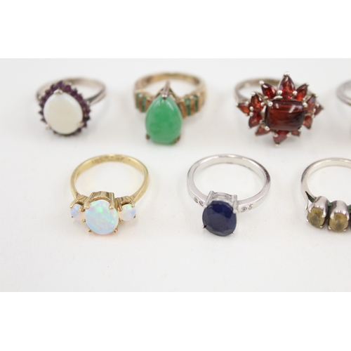 450 - Ten silver stone set rings includinh opal and ruby (41g)