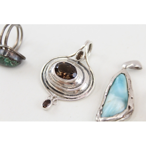 455 - A collection of silver gemstone set pendants (50g)