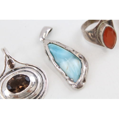 455 - A collection of silver gemstone set pendants (50g)