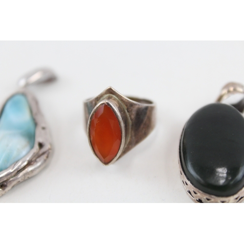 455 - A collection of silver gemstone set pendants (50g)