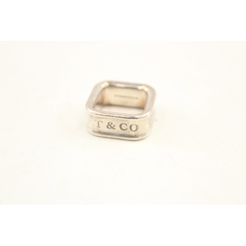 458 - Two silver rings by Tiffany and Co (19g)