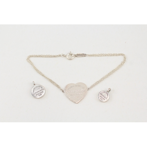 469 - Two silver pendants and a bracelet by Tiffany and Co (6g)