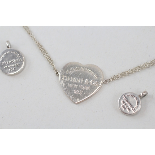 469 - Two silver pendants and a bracelet by Tiffany and Co (6g)