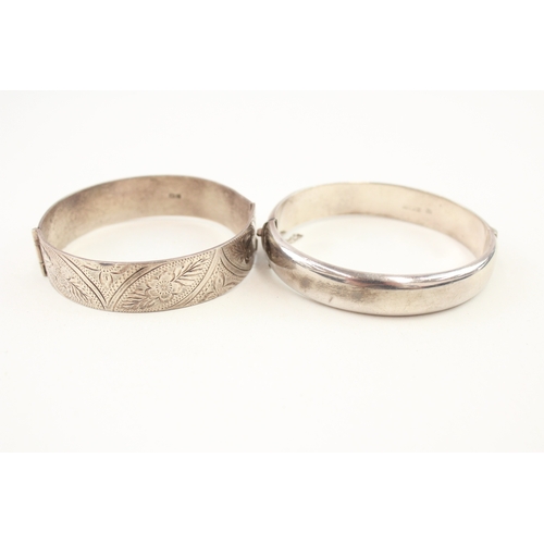 476 - Two vintage silver floral design bangles (56g)