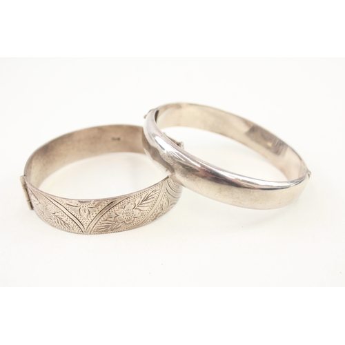 476 - Two vintage silver floral design bangles (56g)