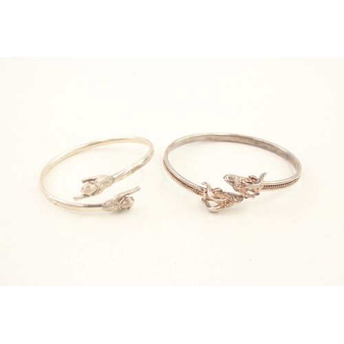 477 - Two silver bypass bangles (23g)