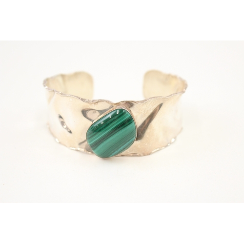 482 - A silver malachite set bangle (38g)