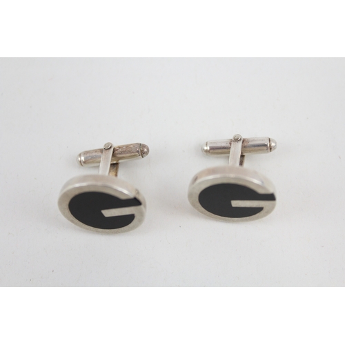 485 - A pair of silver cufflinks by Gucci (24g)