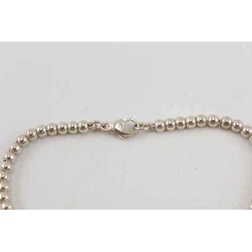 486 - A silver beaded bracelet by Tiffany and Co (5g)