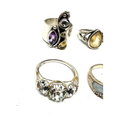 386 - 6 silver gemstone set rings