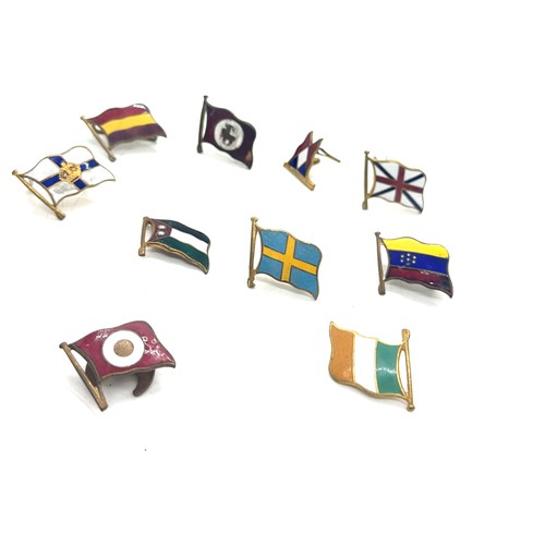 570 - 10 different vintage enamelled shipping line lapel badge flags