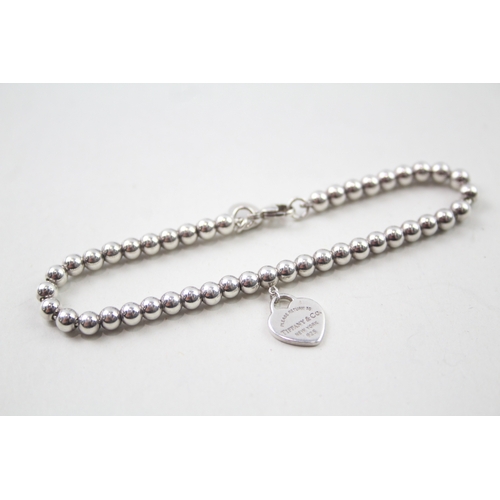 416 - Silver ball link bracelet with heart charm by designer Tiffany & Co (5g)