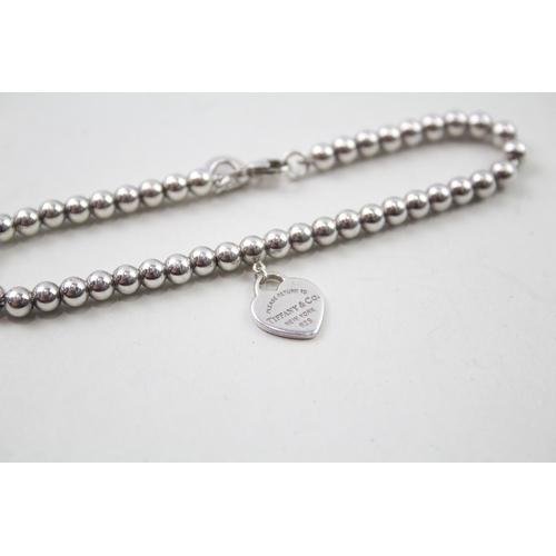 416 - Silver ball link bracelet with heart charm by designer Tiffany & Co (5g)