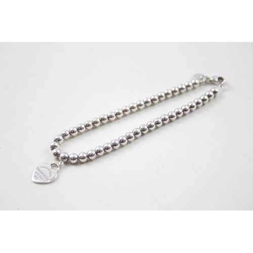 416 - Silver ball link bracelet with heart charm by designer Tiffany & Co (5g)