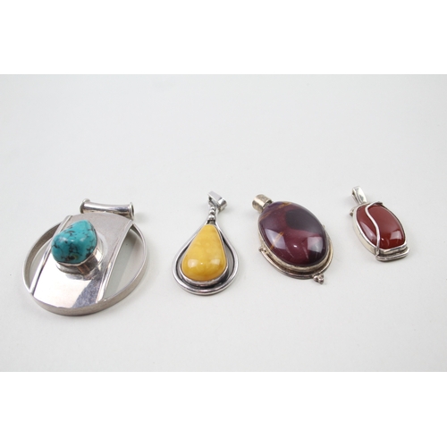 394 - Four silver gemstone pendants including Mookaite (67g)