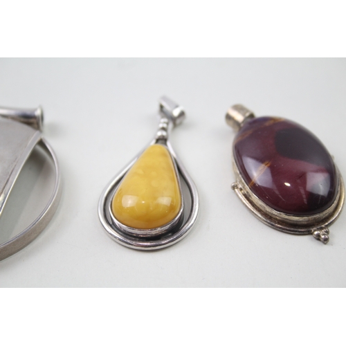 394 - Four silver gemstone pendants including Mookaite (67g)