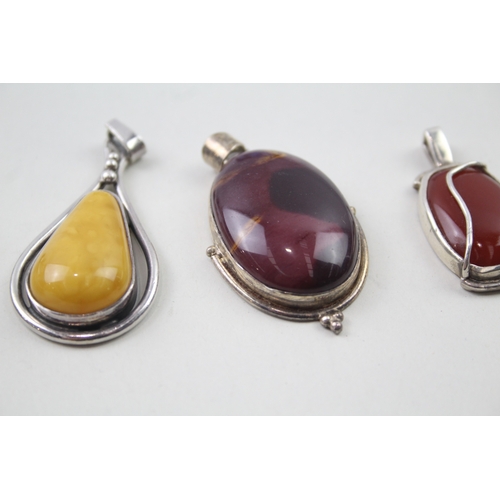 394 - Four silver gemstone pendants including Mookaite (67g)