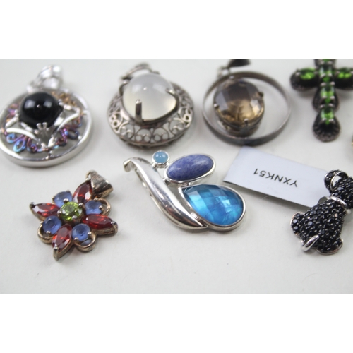 395 - A collection of silver gemstone pendants including Diamond (44g)