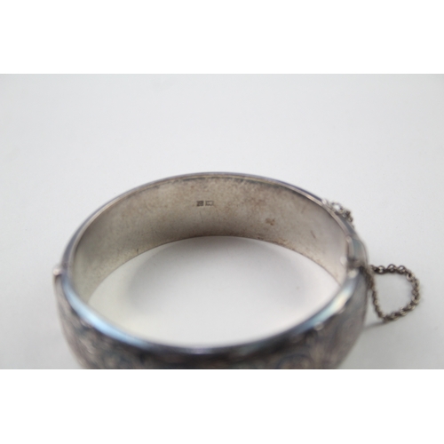 396 - Silver vintage bangle with scrolling etched design (39g)