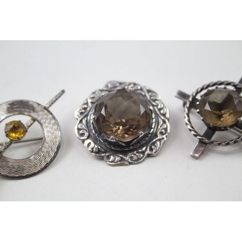 399 - Four silver Scottish brooches including gemstone (38g)