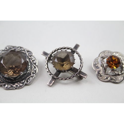 399 - Four silver Scottish brooches including gemstone (38g)