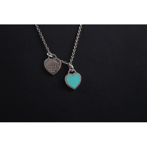 412 - Silver necklace with two heart pendants by designer Tiffany & Co (3g)