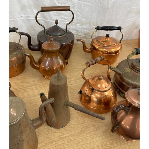 103 - Large selection of assorted sized vintage copper kettles