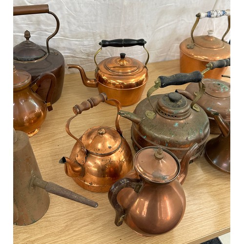 103 - Large selection of assorted sized vintage copper kettles