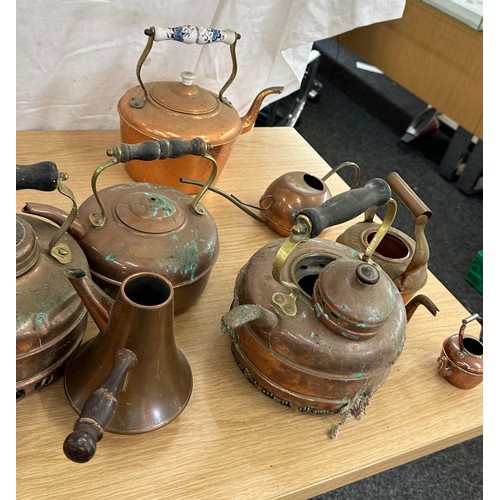 103 - Large selection of assorted sized vintage copper kettles