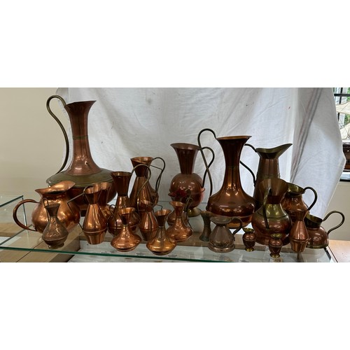 164 - Large selection of vintage copper jugs assorted sizes