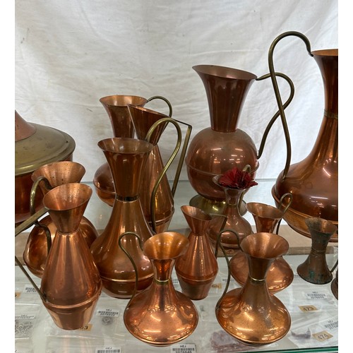 164 - Large selection of vintage copper jugs assorted sizes