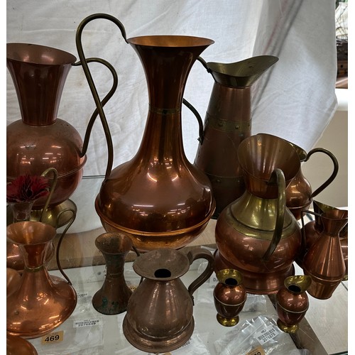 164 - Large selection of vintage copper jugs assorted sizes