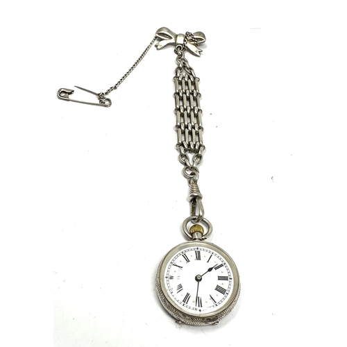 449 - Antique silver fob watch and chain the watch is ticking